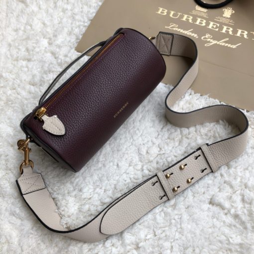 BURBERRY The Leather Barrel Bag. Original Quality Bag including gift box, care book, dust bag, authenticity card. A cylindrical micro bag in block-color leather. Use the military-inspired belt strap to carry it crossbody or on the shoulder. | CRIS&COCO Authentic Quality Designer Bag and Luxury Accessories