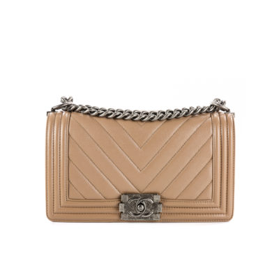 CHANEL Chevron Quilted Leather Flap Bag. Original high quality bag. Authentic design. Original quality printed dust bag and sales box. Created by Karl Lagerfeld, the iconic design owes its name to Gabrielle Chanel's first love, Boy Capel. This Chanel Boy Flap Bag Quilted is every woman's dream. Crafted from calfskin leather, the bag features Chanel's signature chevron quilting, chunky chain link strap with leather shoulder pad, and metal-tone hardware accents. Its CC Boy logo closure opens to a fabric-lined interior with slip pocket perfect for daily essentials. A sought-after, luxurious accessory.| | CRIS&COCO Authentic Quality Designer Bag and Luxury Accessories