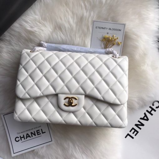 CHANEL 2.55 Classic Diamond Quilted Leather Double Flap Bag. Original Quality Bag. Authentic calfskin. Metal Toned Hardware. CHANEL Sales Box and Dust Bag. Booklet, Authenticity Card. The name 2.55 refers to the release of the bag in February 1955. It had a rectangular turn-lock which was called the Mademoiselle Lock. The 'CC' lock was introduced to the Classic Flap Bags only in the 1980s by designer Karl Lagerfeld. The all chain strap was replaced with the iconic leather interwoven chain link strap. | CRIS&COCO Authentic Quality Designer Bags and Luxury Accessories