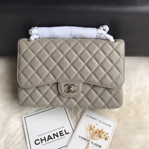 CHANEL 2.55 Classic Diamond Quilted Leather Double Flap Bag. Original Quality Bag. Authentic calfskin. Metal Toned Hardware. CHANEL Sales Box and Dust Bag. Booklet, Authenticity Card. The name 2.55 refers to the release of the bag in February 1955. It had a rectangular turn-lock which was called the Mademoiselle Lock. The 'CC' lock was introduced to the Classic Flap Bags only in the 1980s by designer Karl Lagerfeld. The all chain strap was replaced with the iconic leather interwoven chain link strap. | CRIS&COCO Authentic Quality Designer Bags and Luxury Accessories