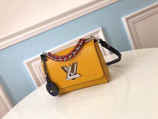 LOUIS VUITTON TWIST Medium Model. Original Quality Bag including gift box, care book, dust bag, authenticity card. For Fall 2019, the Twist MM handbag comes in Epi leather with a braided handle and removable LV Initials charm, echoing the initials of the emblematic LV twist-lock. The luxurious braided handle enables hand-carry whilst the removable leather strap allows the Twist to be carried over the shoulder or cross-body. | CRIS&COCO Authentic Quality Designer Bags and Luxury Accessories