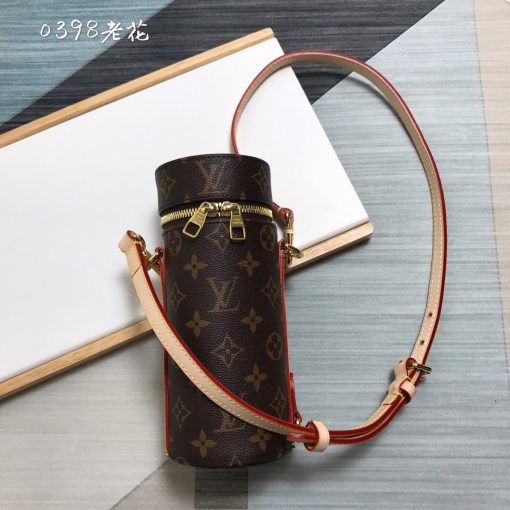 LOUIS VUITTON Bottle Holder. Original Quality Holder including gift box, care book, dust bag, authenticity card. This elegant bottle holder makes the ideal accompaniment for a picnic, an outdoor rendezvous, or playing sports. Embellished with striking Monogram Eclipse canvas, this stylish gift can be used to store small bottles of wine, water, or soda safely. An adjustable strap ensures it can be carried cross-body, over the shoulder, or like a backpack. | CRIS&COCO Authentic Quality Designer Bags and Luxury Accessories