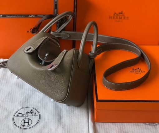 HERMÈS Mini Lindy. High-end quality bag including gift box, literature, dust bag, authenticity card. Maison HERMÈS is elevating the Lindy, with the introduction of the new Mini and is joining the holy Trinity, the Birkin, Kelly, and Constance.| CRIS AND COCO Authentic Quality Luxury Accessories