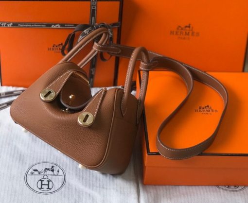 HERMÈS Mini Lindy. High-end quality bag including gift box, literature, dust bag, authenticity card. Maison HERMÈS is elevating the Lindy, with the introduction of the new Mini and is joining the holy Trinity, the Birkin, Kelly, and Constance.| CRIS AND COCO Authentic Quality Luxury Accessories