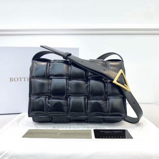 BOTTEGA VENETA Padded Cassette Leather Shoulder Bag. Best Original Quality Bag. Including gift box, literature, dust bag, authenticity card. Creative director Daniel Lee has introduced the Padded Cassette to Bottega Veneta's handbag line. A play on proportion, it features the label's iconic intrecciato technique in a double-faced macro weave. For fans of the brand, this is a must-have addition to your collection. | Cris and Coco the Streetstyle Experience. The Best Quality Designer Bags and Luxury Accessories