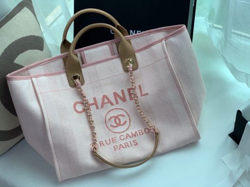 CHANEL Large Deauville Shopping Bag 2021. Authentic quality bag including gift box, booklet, dust bag, authenticity card. The CHANEL Deauville tote matured to a signature CHANEL bag. The bestseller Deauville often appears in seasonal launches in unexpected colors and materials. On the CHANEL website, Chanel calls it the Shopping Bag, but if you walk into a CHANEL boutique and ask for the Deauville, you will be directed to this tote bag. | Cris and Coco Authentic Quality Designer Bags and Luxury Accessories