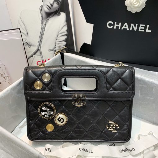 CHANEL Flap Bag with Charms, best high-end quality bag with gift box, dust bag, authenticity card, and CHANEL cloth flower. We love the square-shaped design with a built-in handle for hand carry. Charms give the bag a Punk feel. The center features the CC logo and a woven leather chain strap allows for shoulder carry. | Cris and Coco authentic quality designer bags and luxury accessories.