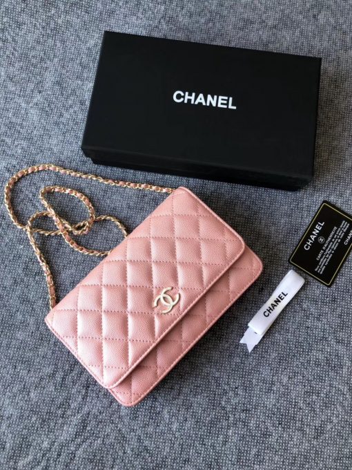 CHANEL Classic Wallet on Chain. Authentic Quality Wallet, including gift box, literature, dust bag, authenticity card. Classic and elegant, a Chanel bag is a fashion statement to your outfit, as seen in this caviar leather flap wallet on chain. Featuring a diamond quilted finish, metal-tone hardware, a foldover top, an internal zipped pocket, an internal slip pocket, an internal logo stamp, a back slip pocket, tortoiseshell details, and a CC turn-lock fastening. | CRIS AND COCO Authentic Quality Designer Bags and Luxury Accessories