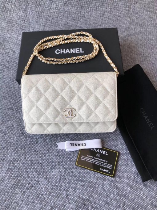 CHANEL Classic Wallet on Chain. Authentic Quality Wallet, including gift box, literature, dust bag, authenticity card. Classic and elegant, a Chanel bag is a fashion statement to your outfit, as seen in this caviar leather flap wallet on chain. Featuring a diamond quilted finish, metal-tone hardware, a foldover top, an internal zipped pocket, an internal slip pocket, an internal logo stamp, a back slip pocket, tortoiseshell details, and a CC turn-lock fastening. | CRIS AND COCO Authentic Quality Designer Bags and Luxury Accessories