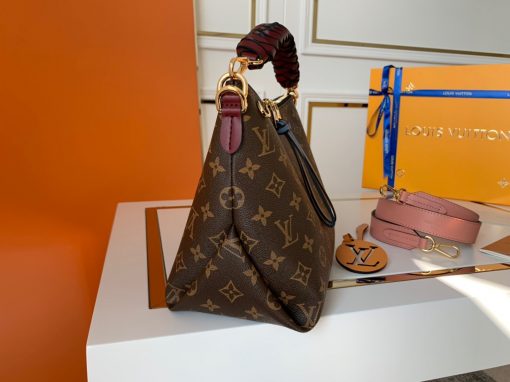 LOUIS VUITTON Beaubourg Hobo Mini Handbag. Authentic Quality Bag, including gift box, literature, dust bag, authenticity card. The adorable Beaubourg Hobo Mini handbag in Monogram canvas comes with a stylishly braided top handle. The House’s exceptional leather craftsmanship can be seen in the hand-painted edge dyeing on the braids. The oversized LV charm adds a sophisticated touch while the colorful name tag and shoulder strap bring a playful feel. This is an excellent handbag, ideal for day wear. | Cris and Coco Authentic Quality Designer Bags and Luxury Accessories