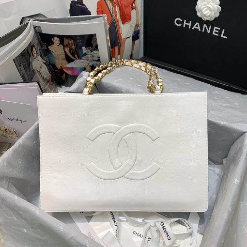 CHANEL Shopping Bag Tote 2020. Original Quality Bag. CHANEL Sales Box and Dust Bag. Booklet, Authenticity Card, Payment Slip. Exuding class and sophistication, the CHANEL Shopping Bag Tote 2020 boasts a real leather construction. Adorned with front logo detail and gold-tone metal hardware, it's the epitome of timeless style. | Cris and Coco Authentic Quality Bags and Luxury Accessories