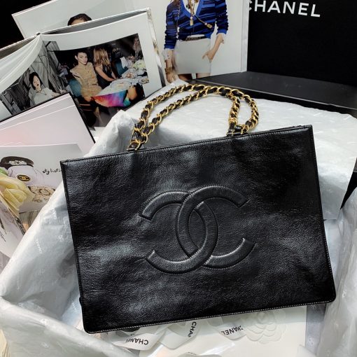 CHANEL Shopping Bag Tote 2020. Original Quality Bag. CHANEL Sales Box and Dust Bag. Booklet, Authenticity Card, Payment Slip. Exuding class and sophistication, the CHANEL Shopping Bag Tote 2020 boasts a real leather construction. Adorned with front logo detail and gold-tone metal hardware, it's the epitome of timeless style. | Cris and Coco Authentic Quality Bags and Luxury Accessories