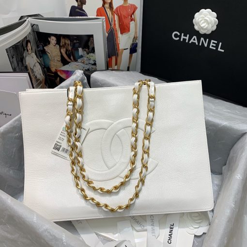 CHANEL Shopping Bag Tote 2020. Original Quality Bag. CHANEL Sales Box and Dust Bag. Booklet, Authenticity Card, Payment Slip. Exuding class and sophistication, the CHANEL Shopping Bag Tote 2020 boasts a real leather construction. Adorned with front logo detail and gold-tone metal hardware, it's the epitome of timeless style. | Cris and Coco Authentic Quality Bags and Luxury Accessories