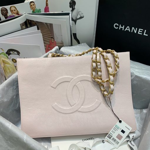 CHANEL Shopping Bag Tote 2020. Original Quality Bag. CHANEL Sales Box and Dust Bag. Booklet, Authenticity Card, Payment Slip. Exuding class and sophistication, the CHANEL Shopping Bag Tote 2020 boasts a real leather construction. Adorned with front logo detail and gold-tone metal hardware, it's the epitome of timeless style. | Cris and Coco Authentic Quality Bags and Luxury Accessories