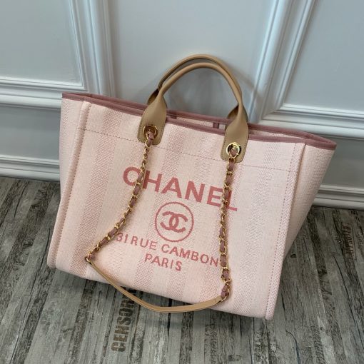 CHANEL Large Deauville Shopping Bag 2021. Authentic quality bag including gift box, booklet, dust bag, authenticity card. The CHANEL Deauville tote matured to a signature CHANEL bag. The bestseller Deauville often appears in seasonal launches in unexpected colors and materials. On the CHANEL website, Chanel calls it the Shopping Bag, but if you walk into a CHANEL boutique and ask for the Deauville, you will be directed to this tote bag. | Cris and Coco Authentic Quality Designer Bags and Luxury Accessories