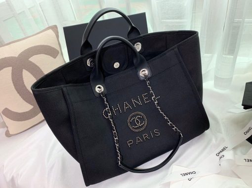 CHANEL Large Deauville Shopping Bag 2021. Authentic quality bag including gift box, booklet, dust bag, authenticity card. The CHANEL Deauville tote matured to a signature CHANEL bag. The bestseller Deauville often appears in seasonal launches in unexpected colors and materials. On the CHANEL website, Chanel calls it the Shopping Bag, but if you walk into a CHANEL boutique and ask for the Deauville, you will be directed to this tote bag. | Cris and Coco Authentic Quality Designer Bags and Luxury Accessories