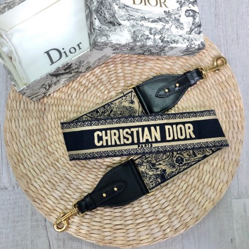 DIOR Christian Dior Shoulder Strap. Original Quality Strap including gift box, care book, dust bag, authenticity card. The 'Christian Dior' signature is featured at the center of the slender shape, framed by black calfskin on either side. Two antique gold-finish metal snap hooks attach the strap to the bag of choice. The strap may be worn over the shoulder or crossbody for a highly personalized style. | CRIS&COCO Authentic Quality Designer Bags and Luxury Accessories