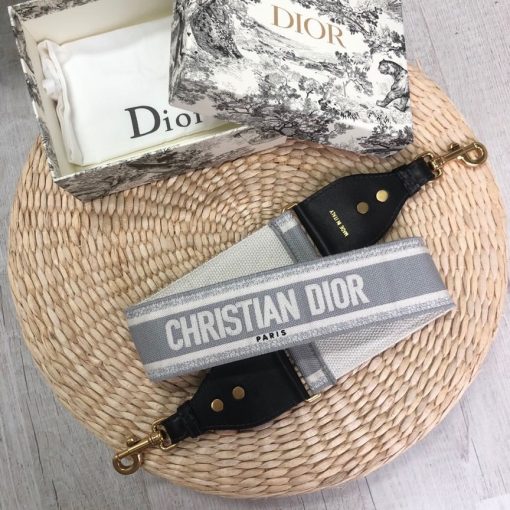 DIOR Christian Dior Shoulder Strap. Original Quality Strap including gift box, care book, dust bag, authenticity card. The 'Christian Dior' signature is featured at the center of the slender shape, framed by black calfskin on either side. Two antique gold-finish metal snap hooks attach the strap to the bag of choice. The strap may be worn over the shoulder or crossbody for a highly personalized style. | CRIS&COCO Authentic Quality Designer Bags and Luxury Accessories