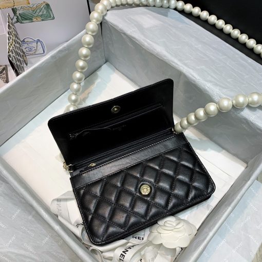 Chanel Wallet on Chain (WOC) Pearls. Original Quality Bag including gift box, care book, dust bag, authenticity card. This style is part of Chanel’s Fall/Winter 2020 Collection. The classic lambskin wallet on chain gets a chic new update with a strap adorned with imitation pearls. It is available in the regular size. The pearl strap is one of the most popular designs from the collection. Chanel’s iconic pearls brings in an elegant touch on the casual WOC. It can be worn as an everyday bag or used as an evening bag. | CRIS&COCO Authentic Quality Designer Bags and Luxury Accessories