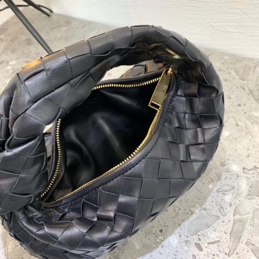 BOTTEGA VENETA The Jodie Hobo Bag. Original Quality Bag including gift box, care book, dust bag, authenticity card. This rounded mini hobo bag in woven leather is woven by hand with a curved, seamless structure. It has Iconic Intrecciato 15 weaves in a subtly amplified new dimension. This bag is soft, draped shape with knot detail on the handle. | CRIS&COCO Authentic Quality Designer Bags and Luxury Accessories