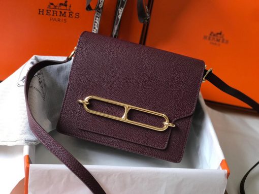 HERMÈS Mini Roulis 18 Bag. Original Quality Bag including gift box, care book, dust bag, authenticity card. The HERMÈS Roulis Bag is stunning, modest, and elegant creativity from Hermes. A nostalchic and retrofuturistic drifter, the Roulis trades its good behavior and stately demeanor for mischievous strolls and boat trips. Its jewel clasp revisits the “Chaîne d’ancre” link. This laid-back, practical, chic piece, in its mini-size version, crosses oceans and decades at full speed. | CRIS&COCO Authentic Quality Designer Bags and Luxury Accessories