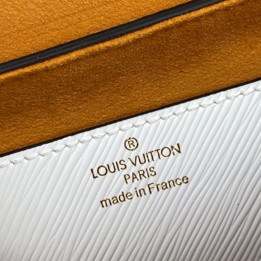 LOUIS VUITTON Twist PM. Original Quality Bag including gift box, care book, dust bag, authenticity card. This bag is a true statement-maker on any of your attire, the design itself speaks a lot; especially the remarkable LV signature on the front. Kudos to the clever minds; the design is truly deceptive in appearance. The classic handbag in grained white Epi leather takes on a new appeal thanks to its removable jacquard strap with 'Louis Vuitton' woven into the fabric and a leather LV charm. The adjustable strap, which offers shoulder or cross-body carry, comes in a tone-on-tone caramel colorway. | CRIS&COCO Authentic Quality Designer Bags and Luxury Accessories