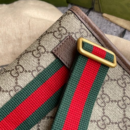 GUCCI Neo Vintage GG Supreme belt bag. The belt bag in GG Supreme has a retro-influenced design. Trimmed with leather, the style is meant to be worn around the waist, securing with a Web strap and buckle closure. Beige/ebony GG Supreme canvas, a material with low environmental impact, with brown leather trims. Green and red Web. Oval Gucci leather tag with a feline head. Adjustable nylon Web belt with plastic buckle closure. | CRIS&COCO Authentic Quality Designer Bags and Luxury Accessories