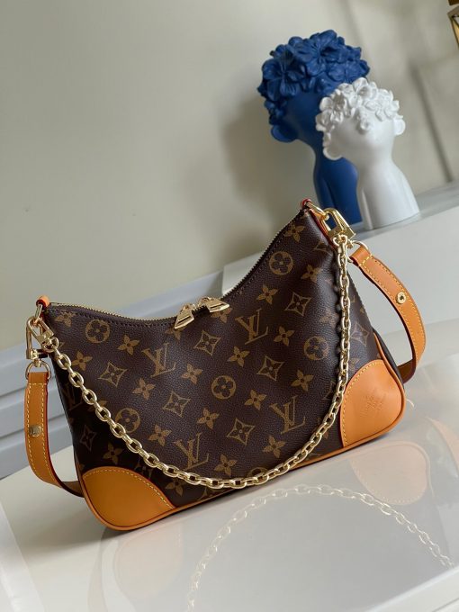 LOUIS VUITTON Boulogne Handbag. Original Quality Bag including gift box, care book, dust bag, authenticity card. The versatile Boulogne handbag is made from classic Monogram canvas and features a removable strap, enabling cross-body, long-shoulder and short-shoulder carry. Without its strap, the Boulogne becomes a small chain bag or clutch for more formal occasions. It has a double-zip opening and an inside flat pocket large enough for an iPhone 12 Pro. | CRIS&COCO Authentic Quality Designer Bags and Luxury Accessories