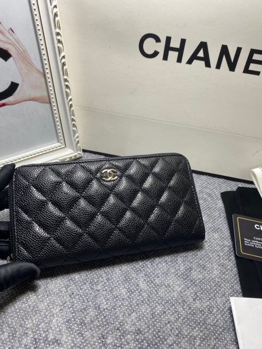 CHANEL Classic Long Zipped Wallet.  Original Quality Wallet including gift box, care book, dust bag, authenticity card. This wallet is one of the signature wallets of Chanel. It has been around for some time now and it will continue to stick around. This wallet is practical and amazing; perfect to hold paper money, credit cards and coins. The classic black color, you will get the signature burgundy colored interior. | CRIS&COCO Authentic Quality Designer Bags and Luxury Accessories