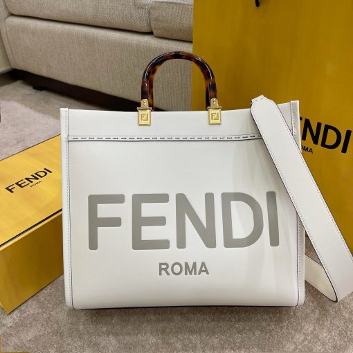 FENDI Sunshine Medium Tote. Original Quality Bag including gift box, care book, dust bag, authenticity card. Equipped with a spacious lined internal compartment, edges in tone on tone leather, and gold-finish hardware. Can be carried by hand or worn on the shoulder thanks to the two handles and detachable shoulder strap.| CRIS&COCO Authentic Quality Designer Bags and Luxury Accessories