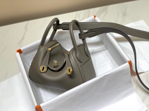 HERMÈS Mini Lindy. High-end quality bag including gift box, literature, dust bag, authenticity card. Maison HERMÈS is elevating the Lindy, with the introduction of the new Mini and is joining the holy Trinity, the Birkin, Kelly, and Constance.| CRIS AND COCO Authentic Quality Luxury Accessories