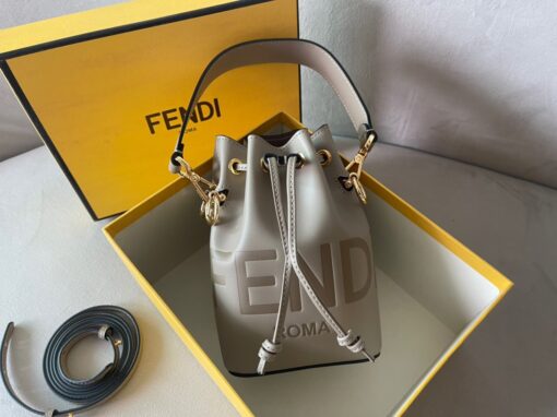 FENDI Mon Tresor Mini Bucket Bag: Style Meets Practicality This Mon Tresor Bag is a chic, minimalist dream. With its drawstring fastening and metal detailing on the sides and eyelets, this bag is as practical as a backpack and can be worn in different ways with its two detachable shoulder straps. It promises a spacious interior and supple leather construction to help store more than the average duffle bag or shoulder bag can manage. Despite it's thoughtfully practical design, it still looks luxurious and glamorous - no wonder it comes with a designer price tag! | CRIS&COCO Authentic Quality Designer Bags and Luxury Accessories