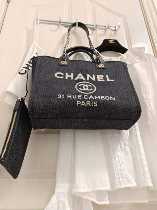 CHANEL Maxi Small Shopping Bag. Original Quality Bag including gift box, care book, dust bag, authenticity card. Luxuriously stylish and chic, this Chanel bag can carry all your essentials and other shopping items. This one is attention grabbing due to its large size and uniquely fun style. The logo comes in white lettering, proudly displaying that it’s a Chanel bag. The interwoven chained shoulder straps and the handles are two practical things you shouldn’t dare miss. Yes, it means you can carry it by the hand or over the shoulder. And just like your high-fashion denim jeans, this new oversized bag is made from denim, which means its durable, strong and easy to maintain. | CRIS&COCO Authentic Quality Designer Bag and Luxury Accessories