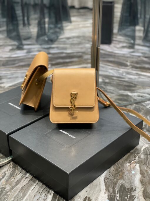 SAINT LAURENT Kaia North/South Shoulder Bag. Original Quality Bag including gift box, care book, dust bag, authenticity card. Saint Laurent's Kaia shoulder bag is named after model Kaia Gerber and was first introduced during the SS20 collection. Finished with refined gold-tone details, this elongated North/South iteration fastens with a magnetic closure and can be worn across the body or on the shoulder thanks to its adjustable strap. | CRIS&COCO Authentic Quality Designer Bags and Luxury Accessories