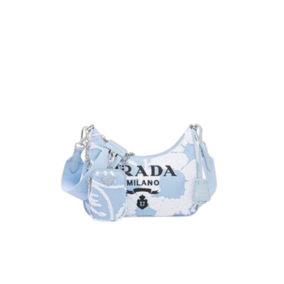 PRADA Re-Edition 2006 Embroidered Drill Shoulder Bag. Original Quality Bag including gift box, care book, dust bag, authenticity card. A new interpretation of an iconic Prada style, this Re-Edition 2005 bag features luxurious embroidery that creates a three-dimensional effect. Completed with a coordinated pouch that attaches to the shoulder strap, the bag can be worn in different ways thanks to the adjustable woven tape shoulder strap and chain handle. | CRIS&COCO Authentic Quality Designer Bags and Luxury Accessories