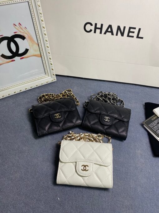 CHANEL Classic Mini Clutch With Chain. Original Quality Bag including gift box, care book, dust bag, authenticity card. The Chanel Classic Mini Clutch is the true authentic beauty because it resembles the Classic Flap Bag. It’s also the mini version of the Clutch With Chain Bag. This Mini Clutch is really tiny. But tiny has its advantage because it can be used in numerous ways. Especially this handbag as it comes with a long chain for shoulder carry. This one can be used as an extra wallet inside your bag. At night it can be carried as an adorable evening accessory. | CRIS&COCO Authentic Quality Designer Bags and Luxury Accessories