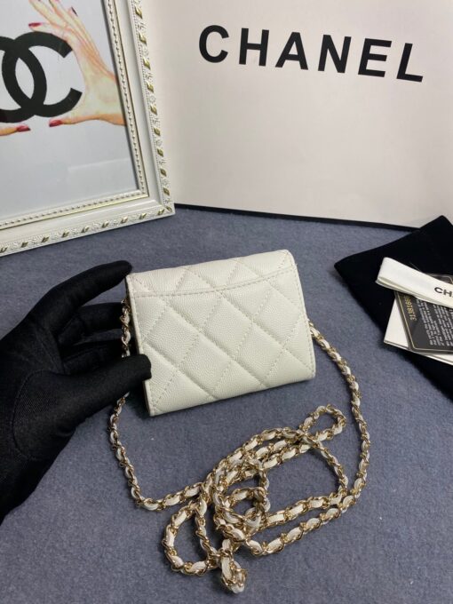 CHANEL Classic Mini Clutch With Chain. Original Quality Bag including gift box, care book, dust bag, authenticity card. The Chanel Classic Mini Clutch is the true authentic beauty because it resembles the Classic Flap Bag. It’s also the mini version of the Clutch With Chain Bag. This Mini Clutch is really tiny. But tiny has its advantage because it can be used in numerous ways. Especially this handbag as it comes with a long chain for shoulder carry. This one can be used as an extra wallet inside your bag. At night it can be carried as an adorable evening accessory. | CRIS&COCO Authentic Quality Designer Bags and Luxury Accessories