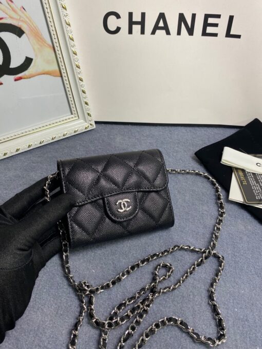 CHANEL Classic Mini Clutch With Chain. Original Quality Bag including gift box, care book, dust bag, authenticity card. The Chanel Classic Mini Clutch is the true authentic beauty because it resembles the Classic Flap Bag. It’s also the mini version of the Clutch With Chain Bag. This Mini Clutch is really tiny. But tiny has its advantage because it can be used in numerous ways. Especially this handbag as it comes with a long chain for shoulder carry. This one can be used as an extra wallet inside your bag. At night it can be carried as an adorable evening accessory. | CRIS&COCO Authentic Quality Designer Bags and Luxury Accessories