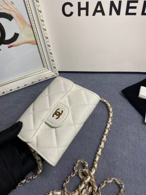 CHANEL Classic Mini Clutch With Chain. Original Quality Bag including gift box, care book, dust bag, authenticity card. The Chanel Classic Mini Clutch is the true authentic beauty because it resembles the Classic Flap Bag. It’s also the mini version of the Clutch With Chain Bag. This Mini Clutch is really tiny. But tiny has its advantage because it can be used in numerous ways. Especially this handbag as it comes with a long chain for shoulder carry. This one can be used as an extra wallet inside your bag. At night it can be carried as an adorable evening accessory. | CRIS&COCO Authentic Quality Designer Bags and Luxury Accessories