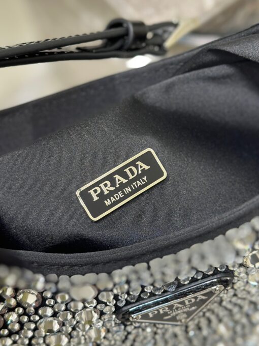 PRADA Cleo Satin Bag With Crystals. Original Quality Bag including gift box, care book, dust bag, authenticity card. Feminine, elegant and modern, the Prada Cleo bag is made of satin and embellished with luminous crystals of different sizes that give the bag refined charm. The sinuous shape that recalls archive styles makes the accessory iconic. | CRIS&COCO Authentic Quality Designer Bags and Luxury Accessories