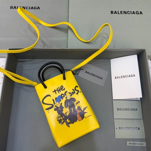 BALENCIAGA Mini Shopping Bag. Original Quality Bag including gift box, care book, dust bag, authenticity card. A new season may be here, but the frenzy for logomania is far from over. At the helm of the trend, Balenciaga continues to offer branded styles. Case in point: this mini shopping bag. Featuring round top handles, a shoulder strap, a strap closure, a main internal compartment and a printed logo to the front. | CRIS&COCO Authentic Quality Designer Bags and Luxury Accessories