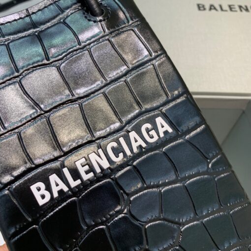 BALENCIAGA Mini Shopping Bag. Original Quality Bag including gift box, care book, dust bag, authenticity card. A new season may be here, but the frenzy for logomania is far from over. At the helm of the trend, Balenciaga continues to offer branded styles. Case in point: this mini shopping bag. Featuring round top handles, a shoulder strap, a strap closure, a main internal compartment and a printed logo to the front. | CRIS&COCO Authentic Quality Designer Bags and Luxury Accessories