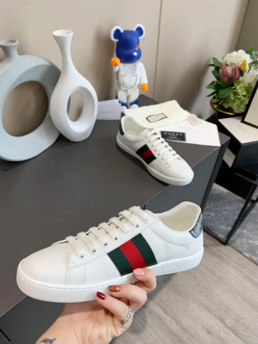 GUCCI Sneaker. Original Quality Sneaker including gift box, care book, dust bag, authenticity card. The classic low-top sneaker in leather with Web detail. These are so great that they would soon become a part of your every day wardrobe. | CRIS&COCO Authentic Quality Designer Bags and Luxury Accessories