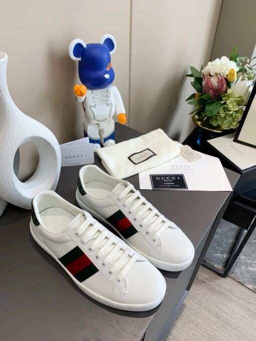 GUCCI Sneaker. Original Quality Sneaker including gift box, care book, dust bag, authenticity card. The classic low-top sneaker in leather with Web detail. These are so great that they would soon become a part of your every day wardrobe. | CRIS&COCO Authentic Quality Designer Bags and Luxury Accessories