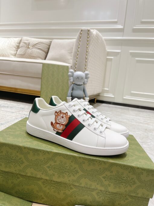 GUCCI Sneaker. Original Quality Sneaker including gift box, care book, dust bag, authenticity card. The classic low-top sneaker in leather with Web detail. These are so great that they would soon become a part of your every day wardrobe. | CRIS&COCO Authentic Quality Designer Bags and Luxury Accessories