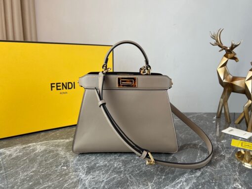 FENDI Peekaboo Iseeu Small. Original Quality Bag including gift box, care book, dust bag, authenticity card. Small, iconic Peekaboo ISeeU bag made of leather and embellished with the classic twist lock on both sides. The bag can be carried by hand or worn either on the shoulder or cross-body thanks to the handle and adjustable, detachable shoulder strap. | CRIS&COCO Authentic Quality Designer Bags and Luxury Accessories