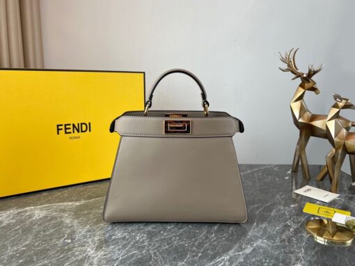 FENDI Peekaboo Iseeu Small. Original Quality Bag including gift box, care book, dust bag, authenticity card. Small, iconic Peekaboo ISeeU bag made of leather and embellished with the classic twist lock on both sides. The bag can be carried by hand or worn either on the shoulder or cross-body thanks to the handle and adjustable, detachable shoulder strap. | CRIS&COCO Authentic Quality Designer Bags and Luxury Accessories