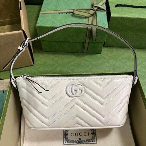 GUCCI GG Marmont Shoulder Bag. Original Quality Bag including gift box, care book, dust bag, authenticity card. The GG Marmont has become synonymous with the House, thanks to its recognizable matelassé fabric and Double G hardware. Continuously reinvented through the seasons, new shapes are introduced within this signature line, matching Gucci's contemporary vision. Presented here in chevron leather, it's further enriched with tonal details. | CRIS&COCO Authentic Quality Designer Bags and Luxury Accessories