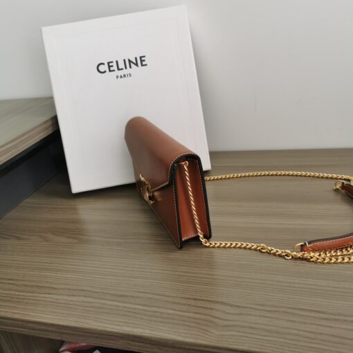 CELINE Wallet On Chain Triomphe. Original Quality Bag including gift box, care book, dust bag, authenticity card. Looking for a reasonable priced high fashion WOC. Take a look at this latest Celine Wallet On Chain from the Spring Summer 2021 Collection. Made from calfskin, this WOC is made for flaunting. The center comes with the famous Triomphe CC logo. There are different colors available, but the bag comes with a chain colored in gold hardware. The chain can also be removed so you can turn it into an evening clutch. You also get a shoulder pad. | CRIS&COCO Authentic Quality Designer Bags and Luxury Accessories