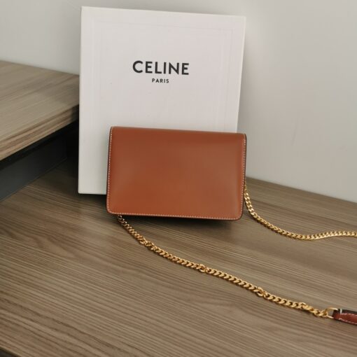 CELINE Wallet On Chain Triomphe. Original Quality Bag including gift box, care book, dust bag, authenticity card. Looking for a reasonable priced high fashion WOC. Take a look at this latest Celine Wallet On Chain from the Spring Summer 2021 Collection. Made from calfskin, this WOC is made for flaunting. The center comes with the famous Triomphe CC logo. There are different colors available, but the bag comes with a chain colored in gold hardware. The chain can also be removed so you can turn it into an evening clutch. You also get a shoulder pad. | CRIS&COCO Authentic Quality Designer Bags and Luxury Accessories